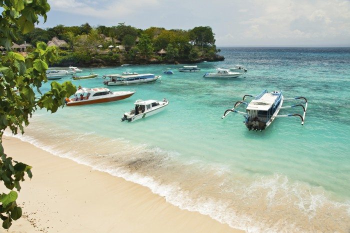 Mooring of boats in a bay of tropical island Lembongan