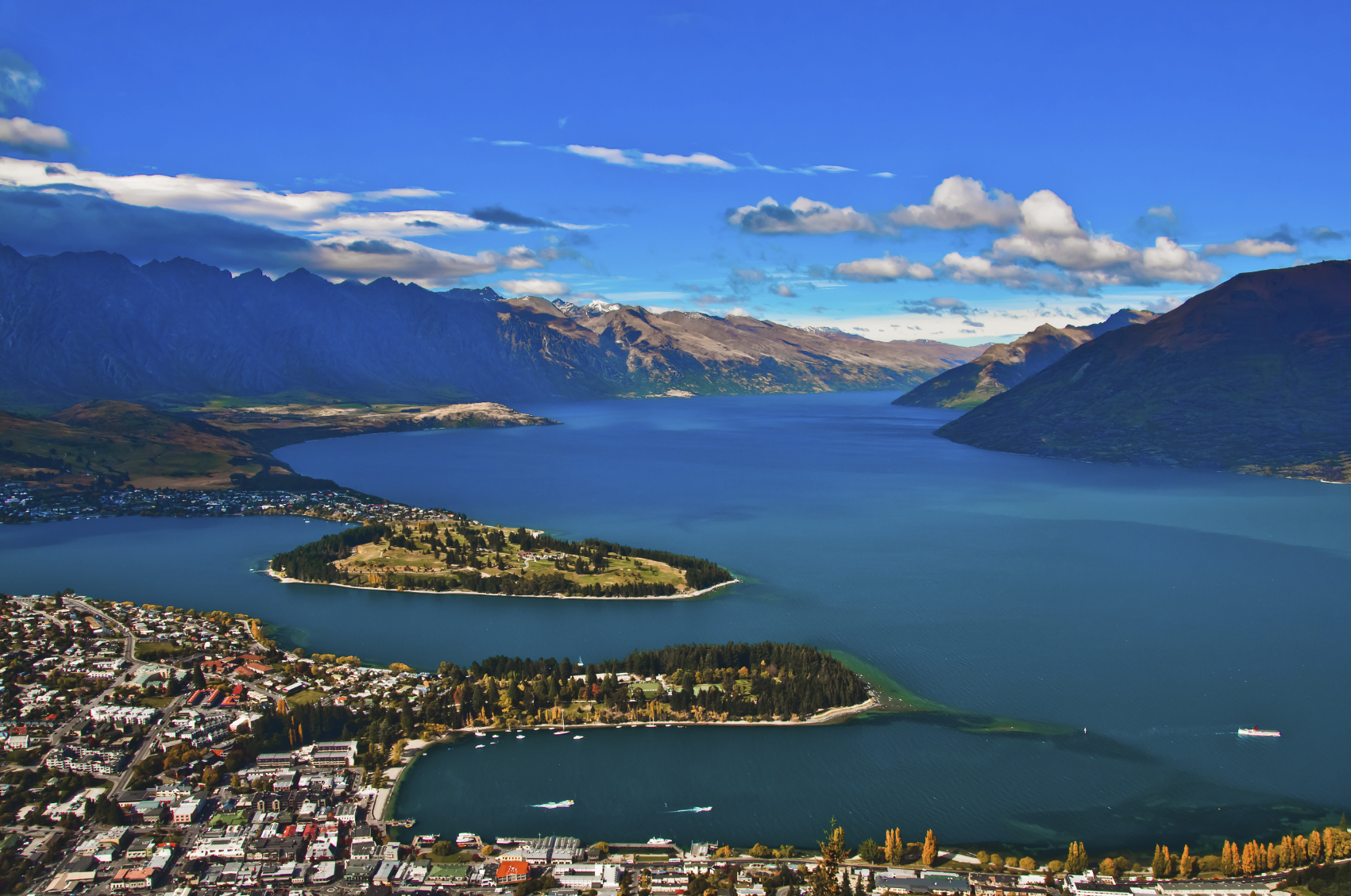 closeup of queenstown with lake Wakatipu from top at noon.